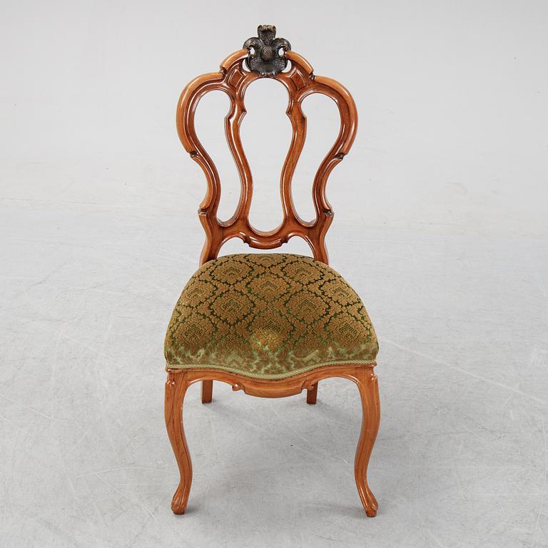 A rococo style sofa, four chairs and a table, second half of the 19th Century.