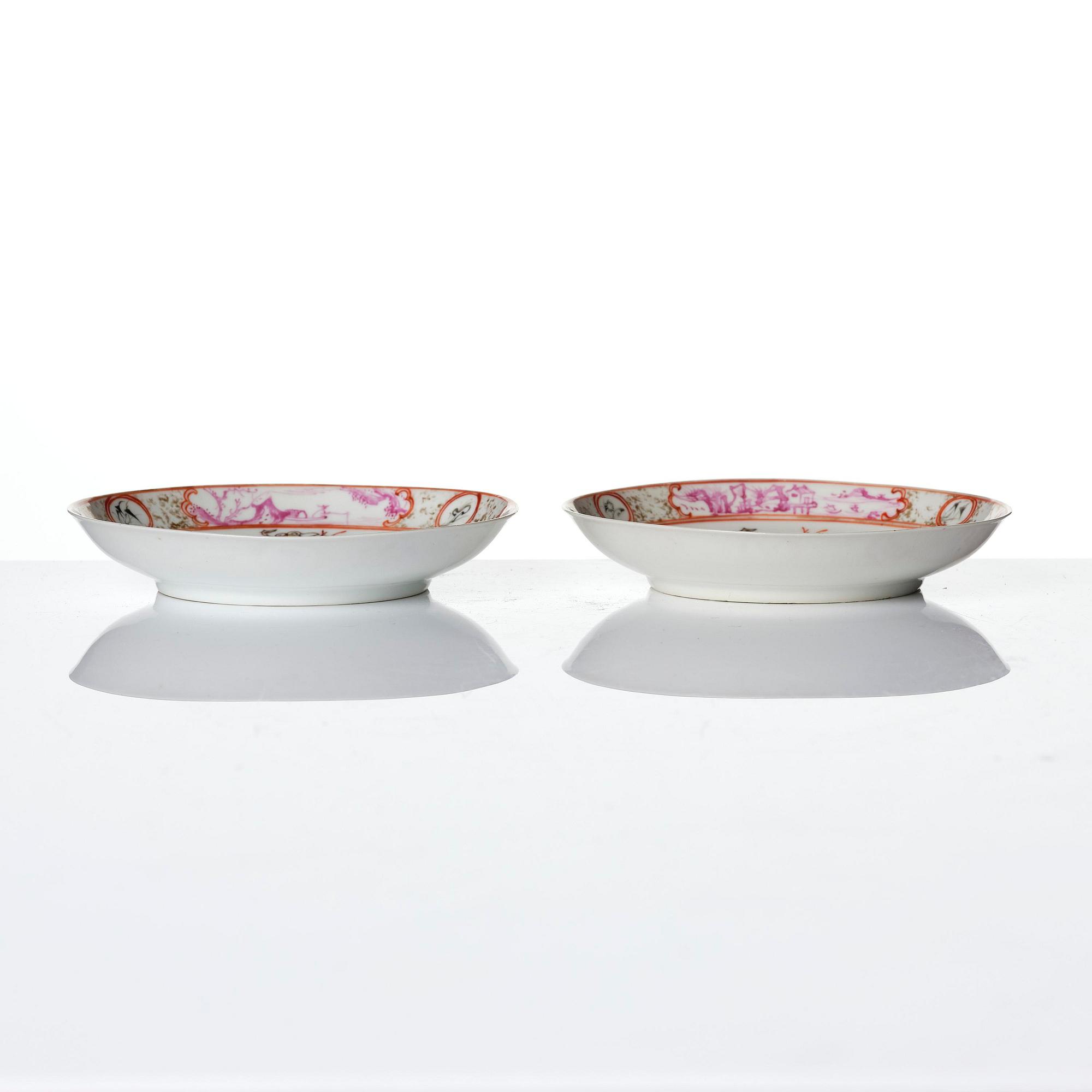 A pair of famille rose 'figural' tea cups with saucers, Qing dynasty, Qianlong (1736-95).