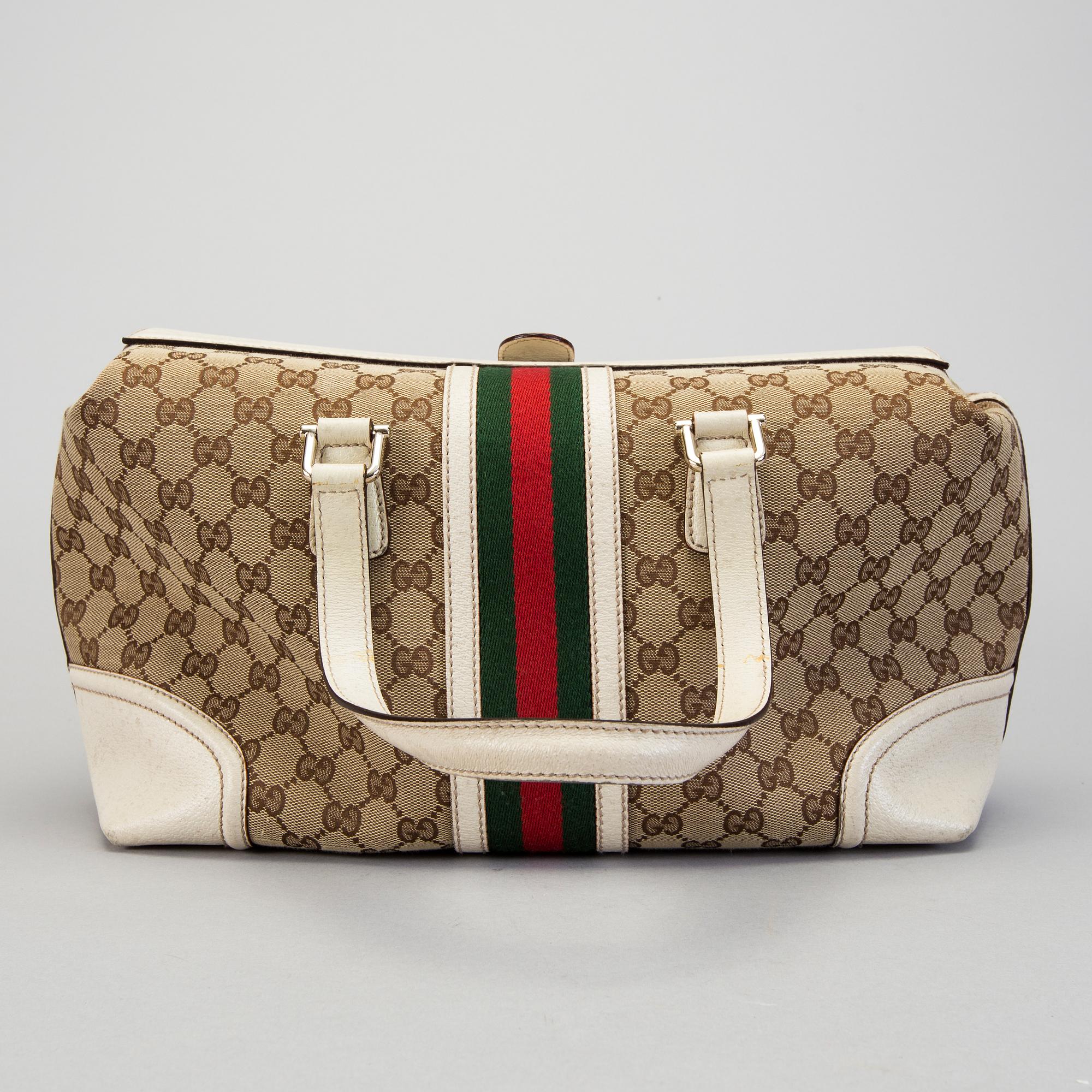 A Gucci canvas and leather hand bag.
