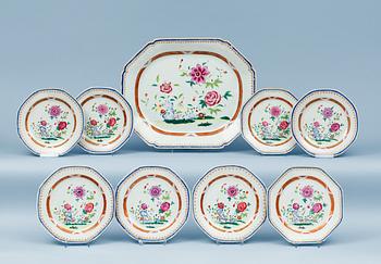 1599. A set of eight famille rose dinner plates and a serving dish, Qing dynasty, Qianlong (1736-95).