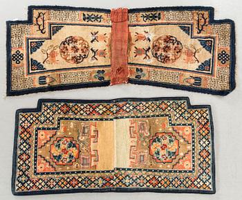 A set of two semiantique/antique Chinese saddle covers, ca 120 x 56 and 143 x 60 cm.