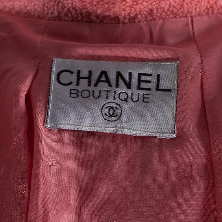 A pink bouclé jacket by Chanel.