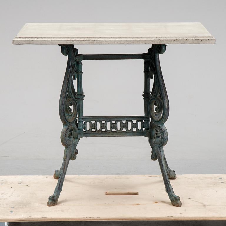 A early 20th Century cast iron garden table with later concrete top.