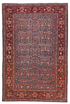 A rug, semi-antique Kashan, ca 197,5 x 132 cm.