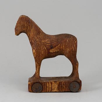 A wooden toy horse, marked Berglinds Leksaksfabr, Nyköping, early 20th century.
