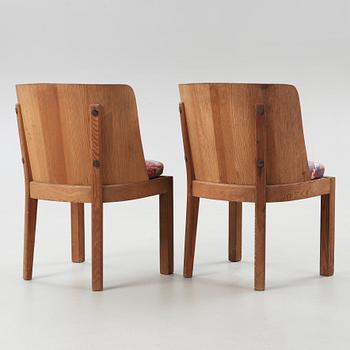 A pair of Axel Einar Hjorth 'Lovö' stained pine armchairs, Nordiska Kompaniet, Sweden 1930's.