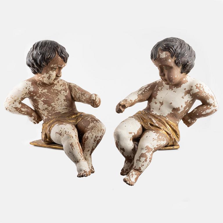 Wooden sculptures, a pair, putto, Europe, first half of the 19th century.