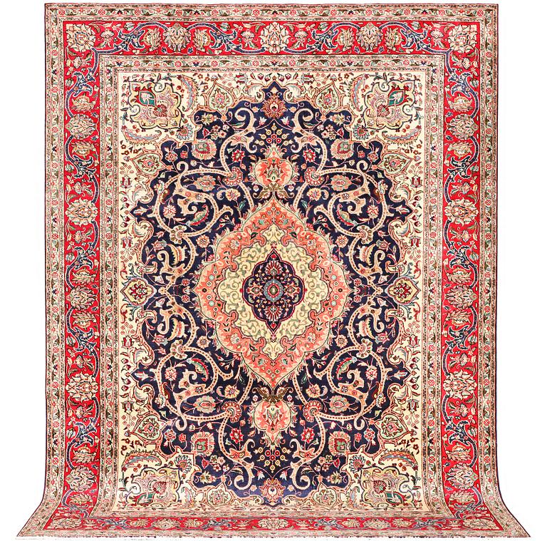 A Tabriz carpet, c. 345 x 255 cm.
