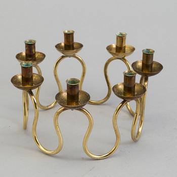 A brass candlestick designed by Lars Holmström for Firma Svenskt Tenn, second half of the 20th century.