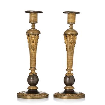 157. A pair of Russian Empire ormolu and patinated bronze candlesticks, Moscow circa 1800.