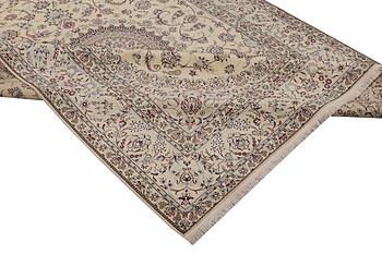 A Nain carpet, part silk, 6 laa, c. 295 x 205 cm.