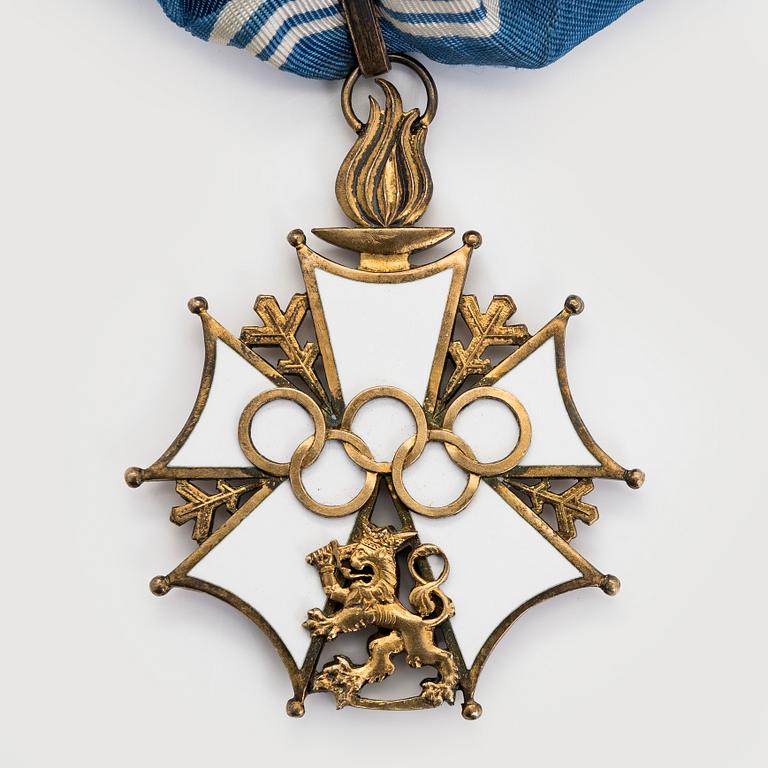 The Finnish olympic cross, 1st class, silver and enamel. Tillander, Helsinki and a Guest of Honor pin.