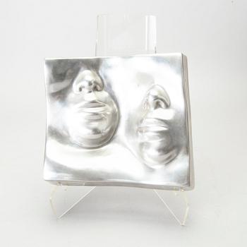 An Barbro Bäckström relief in aluminium. Signed and dated 60/75 1972.