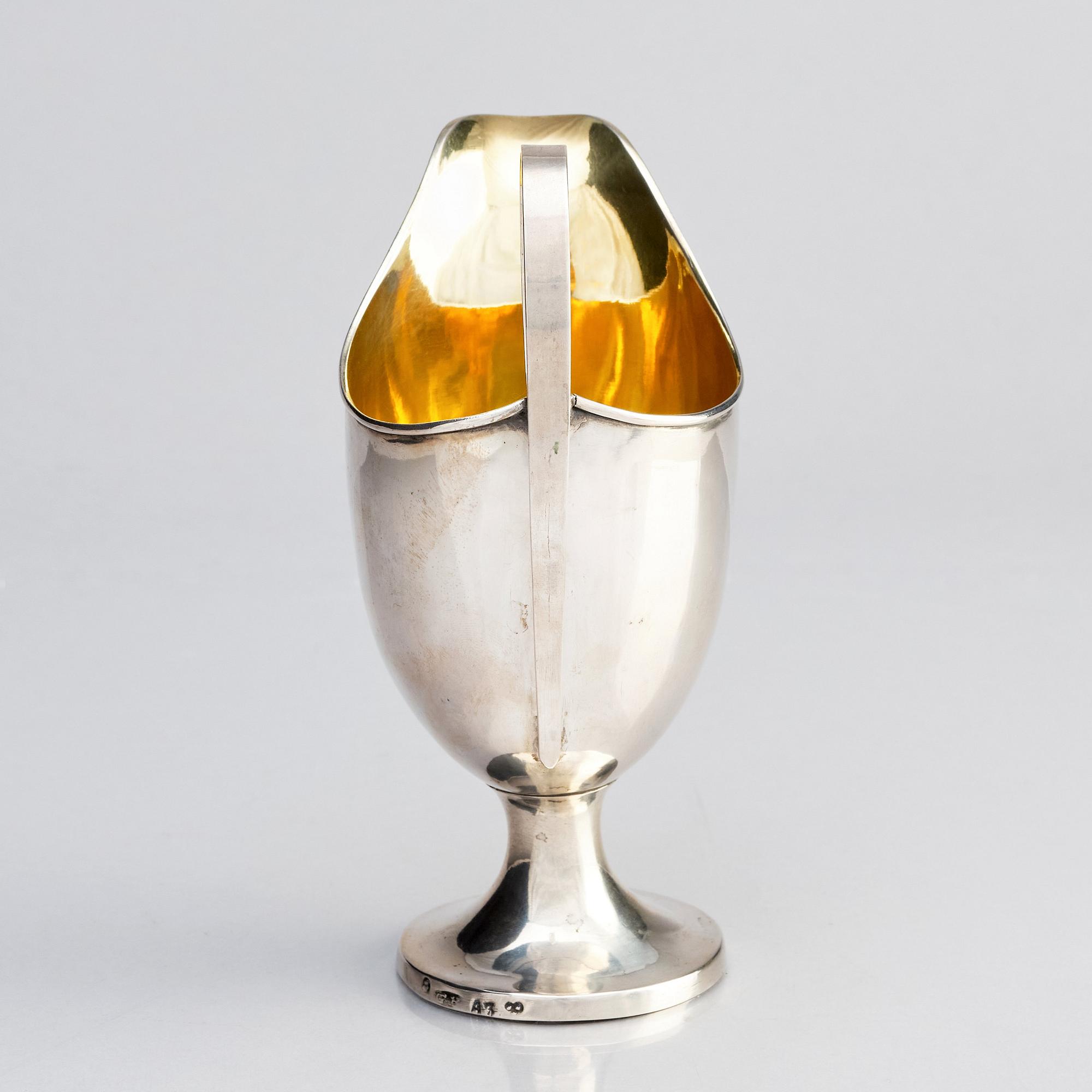 A Swedish parcel-gilt silver cream-jug, mark of Gustaf Hagström, Stockholm 1807.