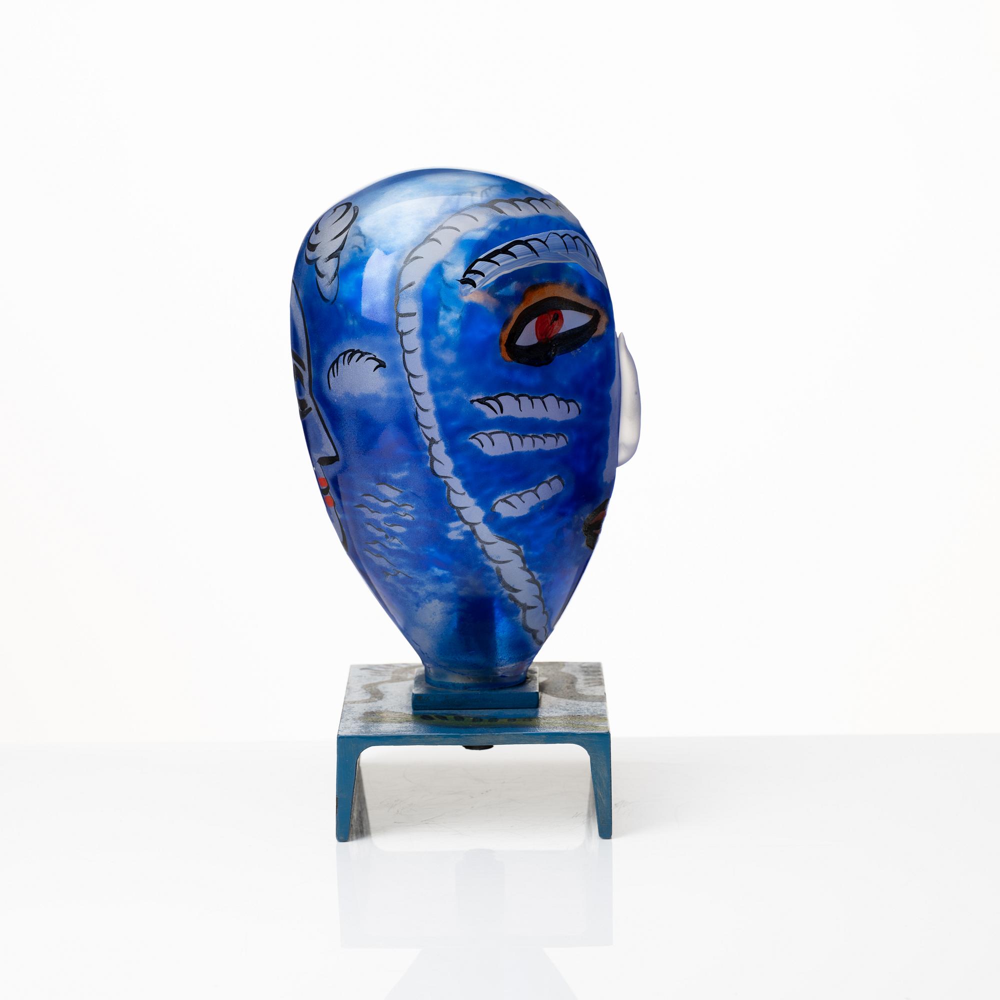 Ulrica Hydman-Vallien, a painted glass and iron sculpture of a face, Sweden.