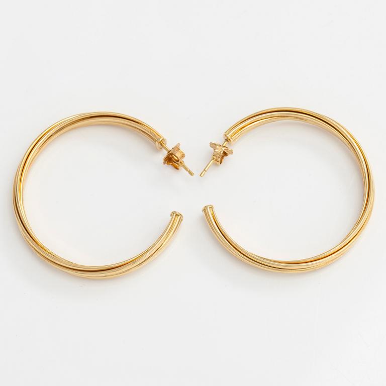 Tiffany & Co, Paloma Picasso, "Melody" hoop earrings in 18K gold.