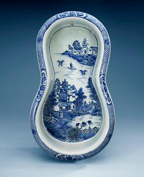 A blue and white bidet with a wooden stand, Qing dynasty, Qianlong (1736-95).