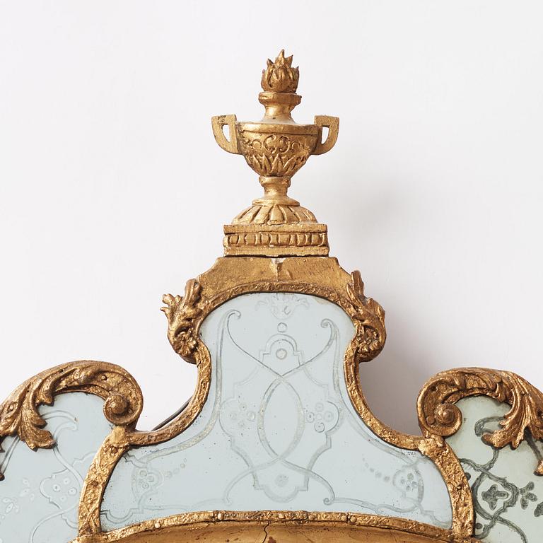 A Baroque gilt-lead and engraved glass mirror in the manner of Burchard Precht, early 18th century.