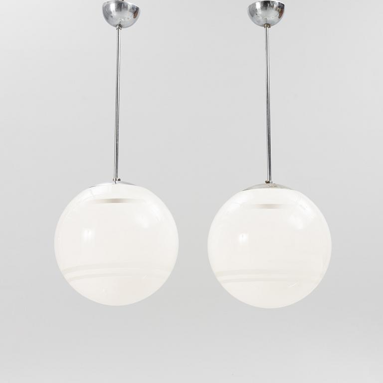 Harald Notini, a pair of ceiling lamps, a version of model "10148", Arvid Böhlmarks Lampfabrik, 1930's.