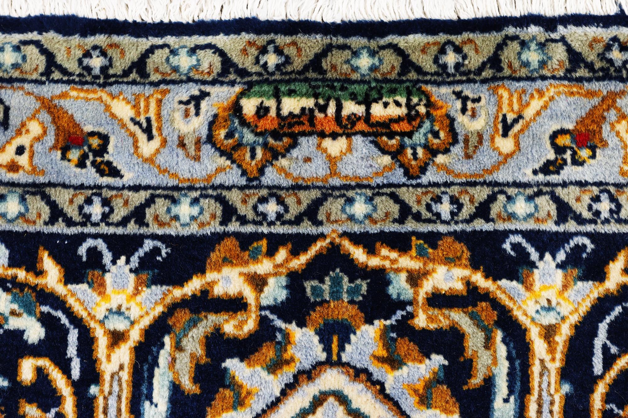 A Kashan carpet, c. 343 x 236 cm.