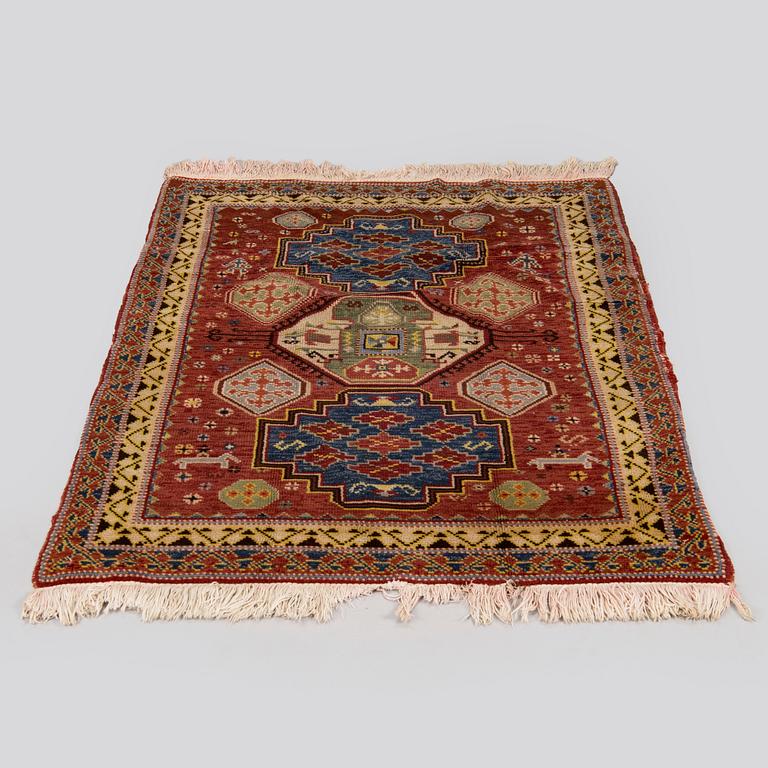 A 1940's Spanish rug Of Kazak design, ca. 139 x 93 cm.