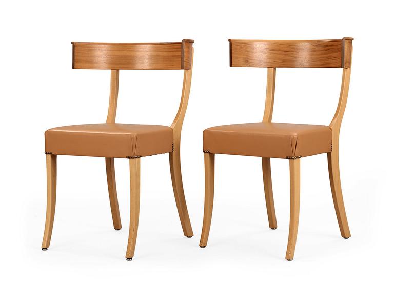 A pair of Josef Frank walnut, beech and brown leather chairs, Svenskt Tenn, model 300.