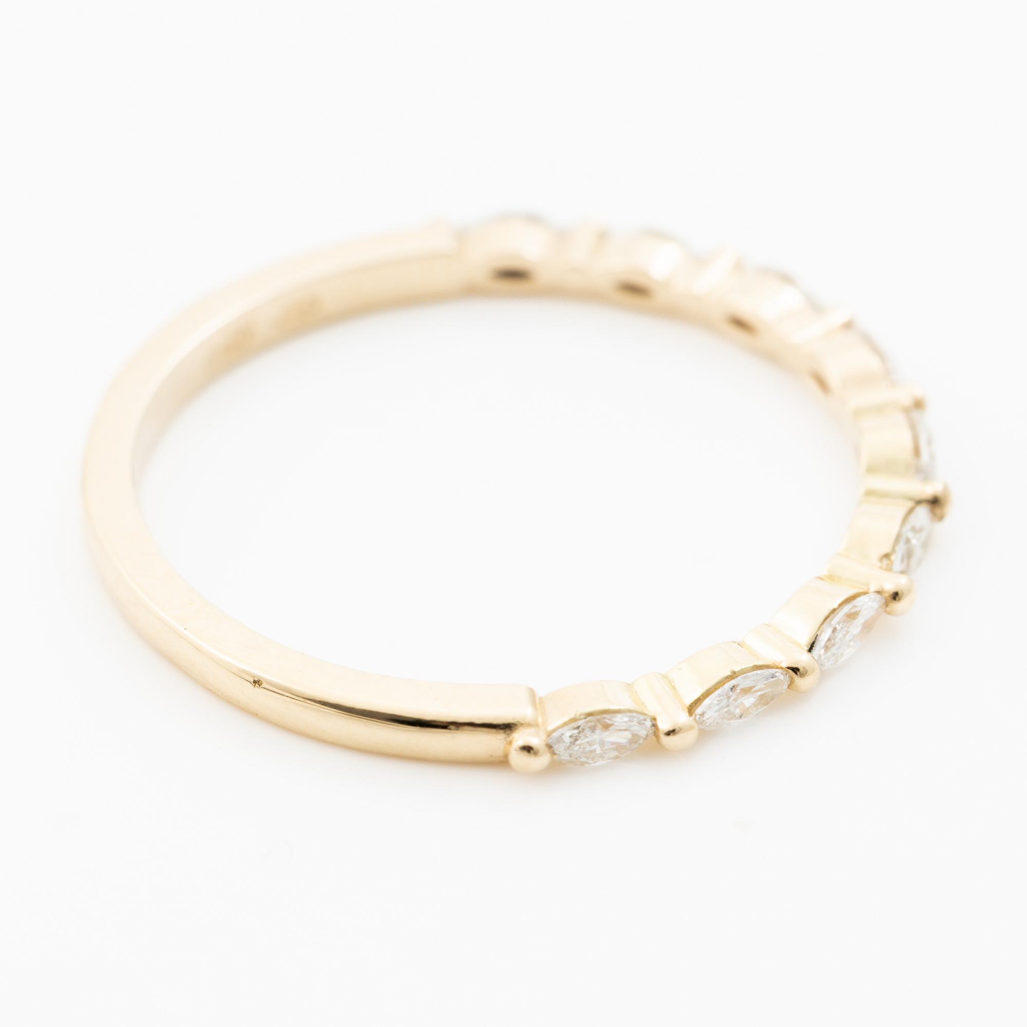 14K gold ring with marquise-cut diamonds.