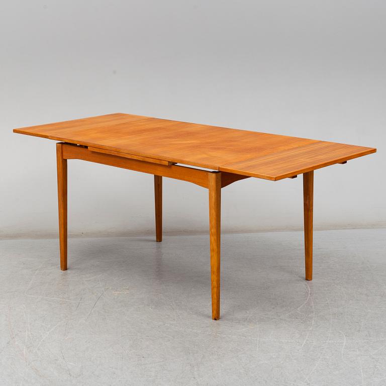 A second half of the 20th century teak veneered dining table.