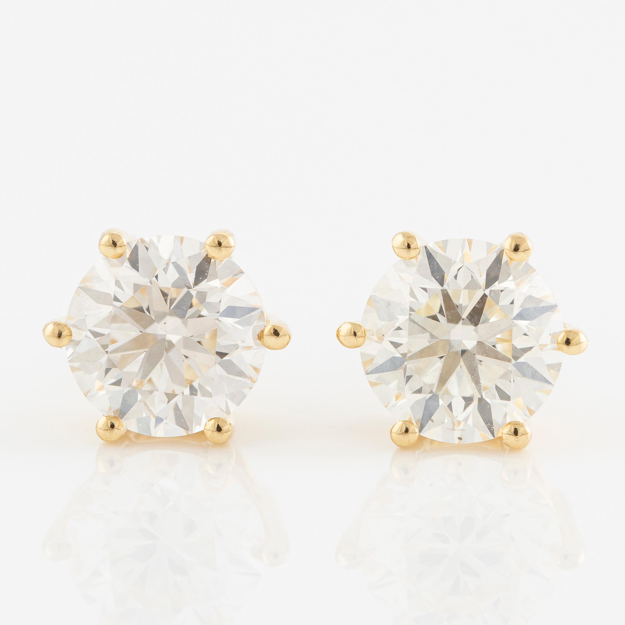 Örhängen 18K guld med briljantslipade diamanter.