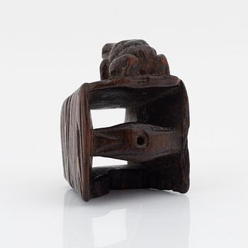 A Japanese wood netsuke of a frog, Masanao Yamada,
Edo period (1615-1868), 19th century.