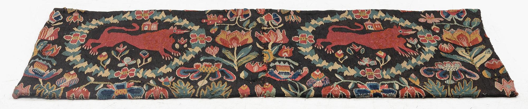 A cushion, 'Red Lion' (Rött Lejon), tapestry weave, ca 86 x 36 cm, southwestern Scania, first part of the 19th century.