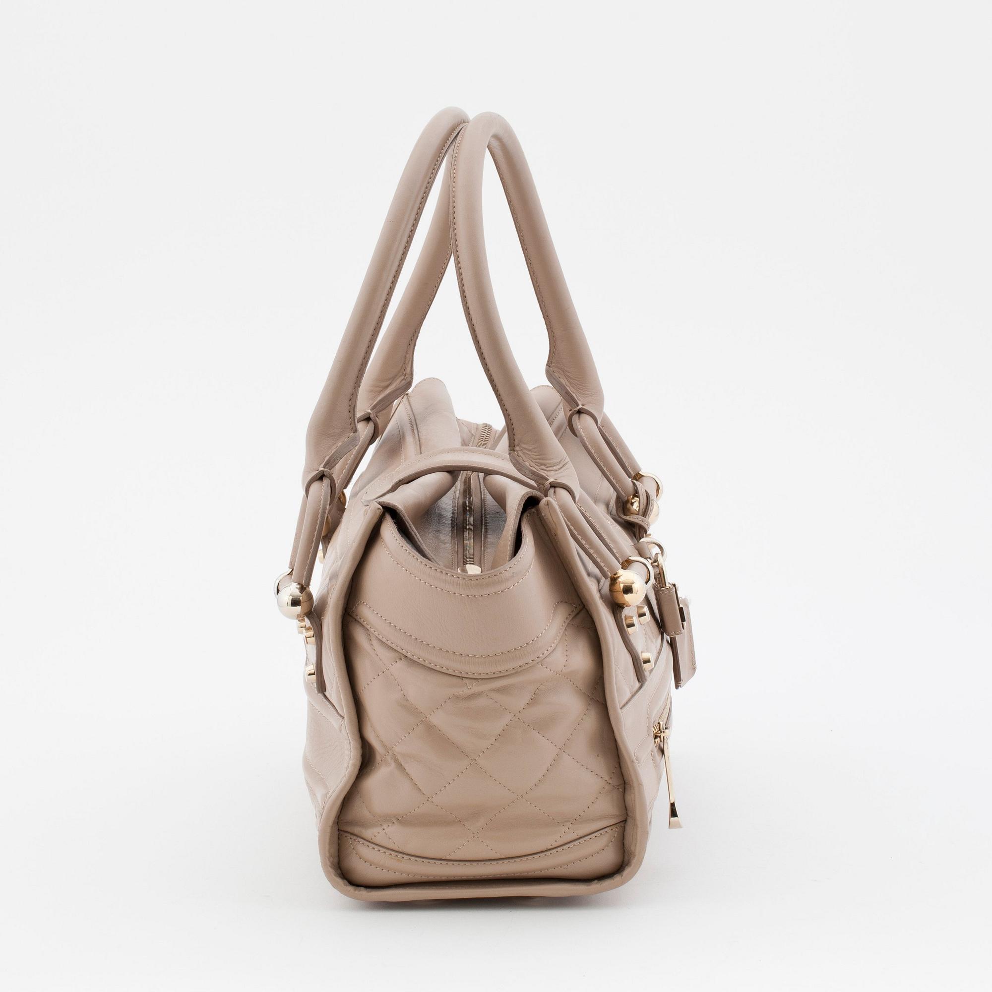 BURBERRY, a beige leather shoulder bag.