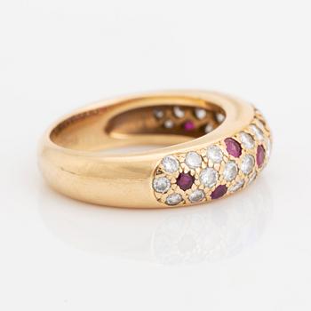 An 18K gold Cartier ring set with round brilliant-cut diamonds and rubies.
