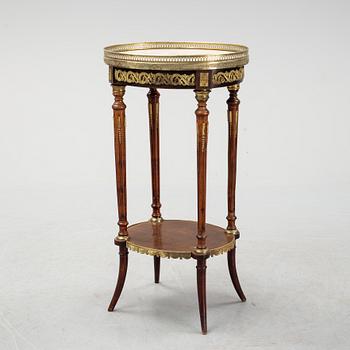 A French Louis XVI-style table, first half of the 20th century.