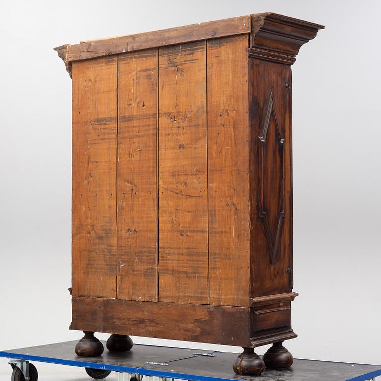 A first half of the 18th Century Baroque stained pine cabinet.