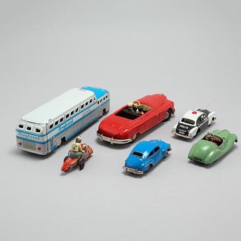 A collection of 6 tin toys, Schuco Akustico 2002, among others, circa mid 20th century.