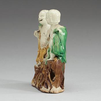 A figure of 'laughing boys', Qing dynasty, 18th Century.