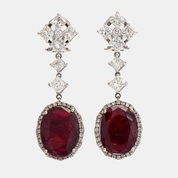 A pair of 18K white gold earrings with rubies ca 20.00 ct in total and diamonds ca 4.28 ct in total. Imort marked Paris.