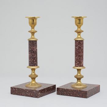 A pair of Swedish late 19th century porphyry candlesticks.