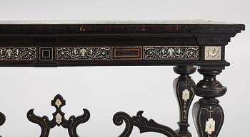 A Renaissance-style ebony, ebonized and ivory-inlaid library table, late 19th century, presumably Germany.