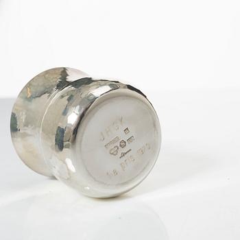 A pair of beakers, two napkin rings, and 17 pieces of cutlery, silver.