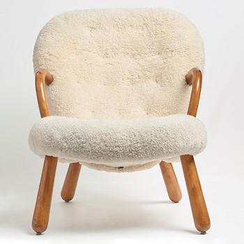 Philip Arctander, attributed to, a Clam Chair re-upholstered in white sheepskin, executed or sold by Vik & Blindheim Norway.