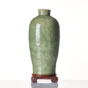 A carved celadon 'longquan' vase, Yuan/Ming dynasty.