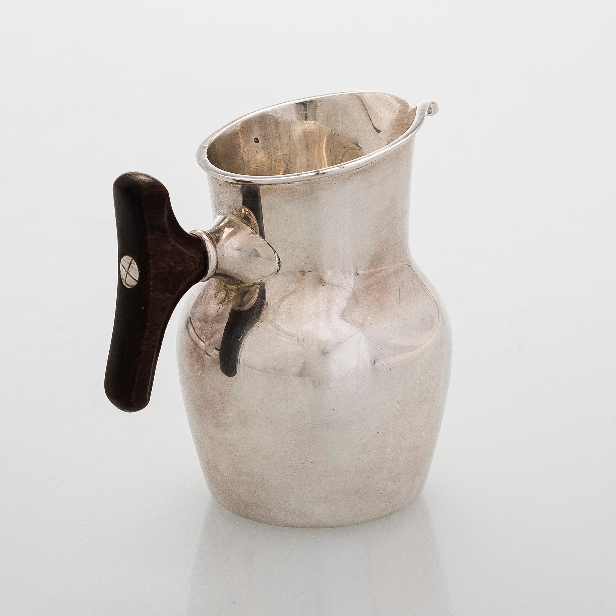 Tapio Wirkkala, a silver and teak cream jug and sugar bowl, Kultakeskus, Hämeenlinna 1959.