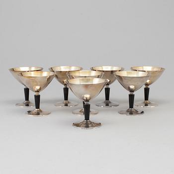 8 pcs of silverplated and bakelite cocktailglasses by Folke Arström.