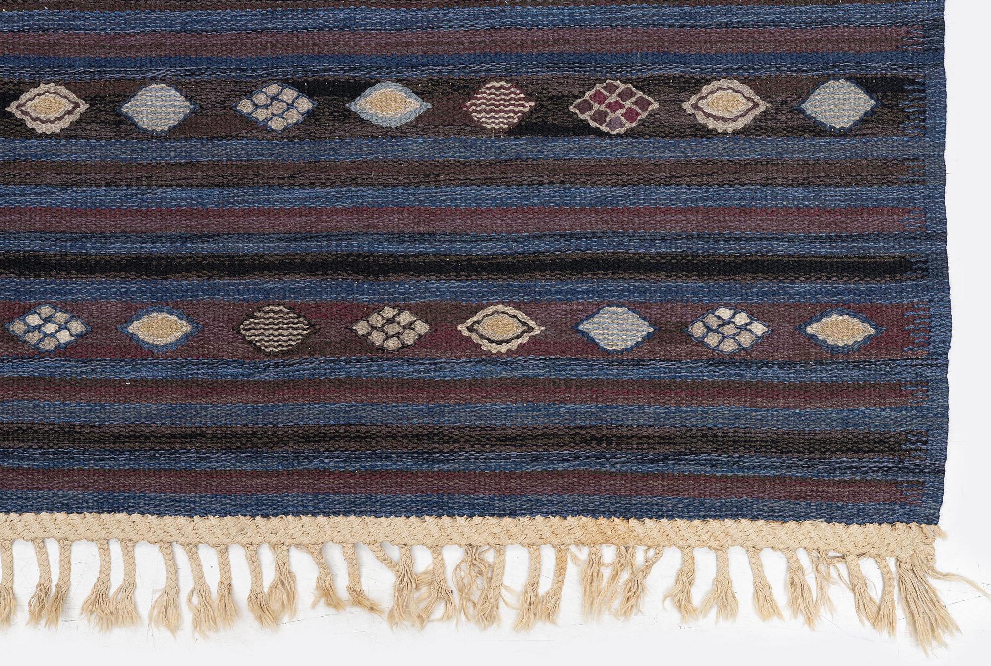 Barbro Nilsson, a carpet, 'Blåbär mörk', tapestry weave, c. 215 x 149 cm, signed AB MMF BN.