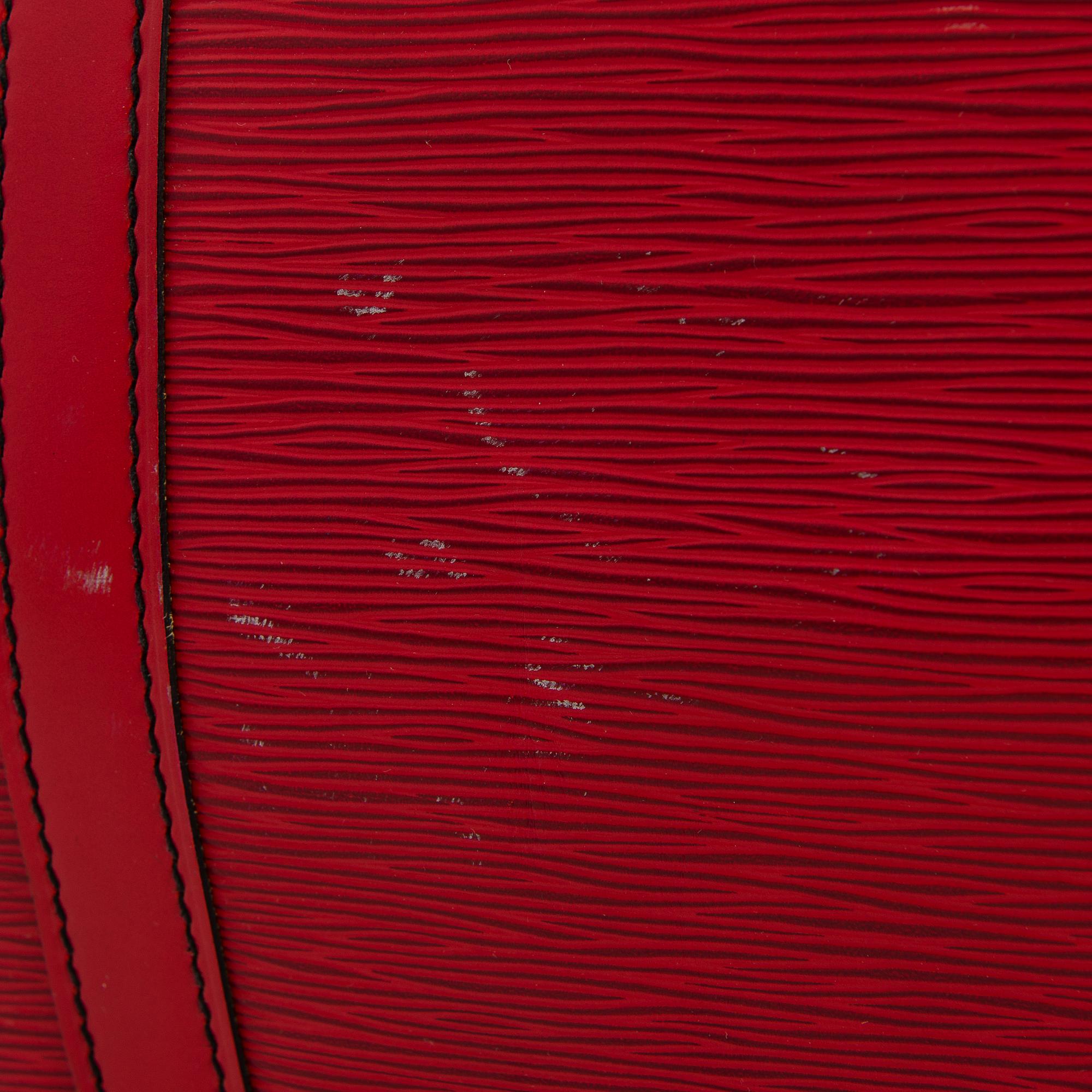 A RED EPI LEATHER KEEPALL TRAVEL BAG.