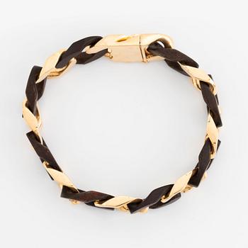 A Van Cleef & Arpels 18K gold and wood bracelet.