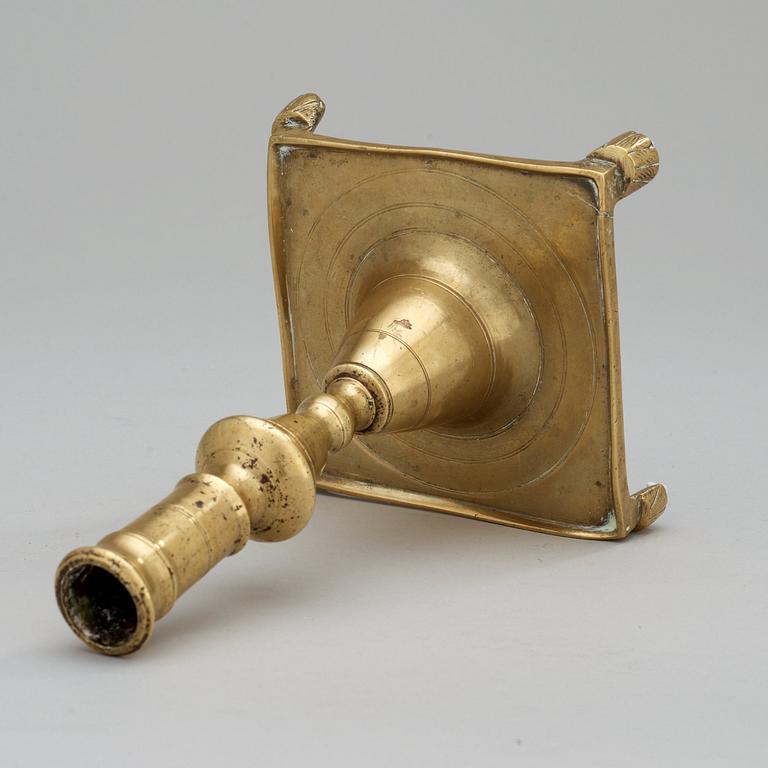 A Baroque 17/18th century brass candlestick.