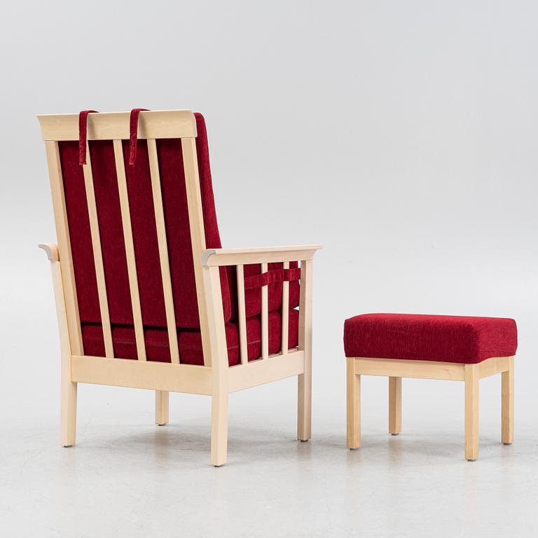 A "Sundborn" easy chair with stool, from Albin I Hyssna.